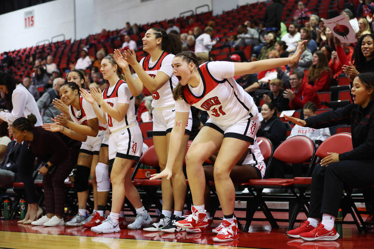 The UNLV Lady Rebels bench reacts after a team score against the Wyoming Cowgirls during the se ...