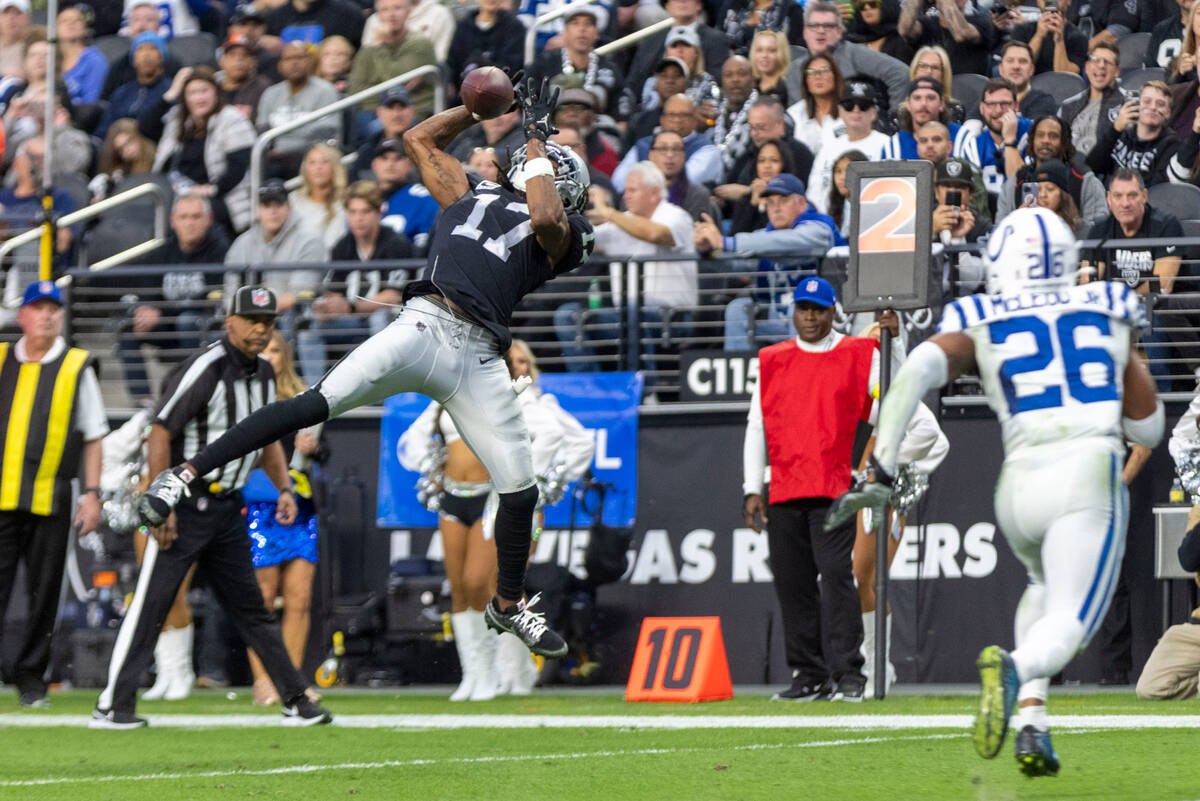 Raiders wide receiver Davante Adams (17) makes a leaping catch with Indianapolis Colts safety R ...