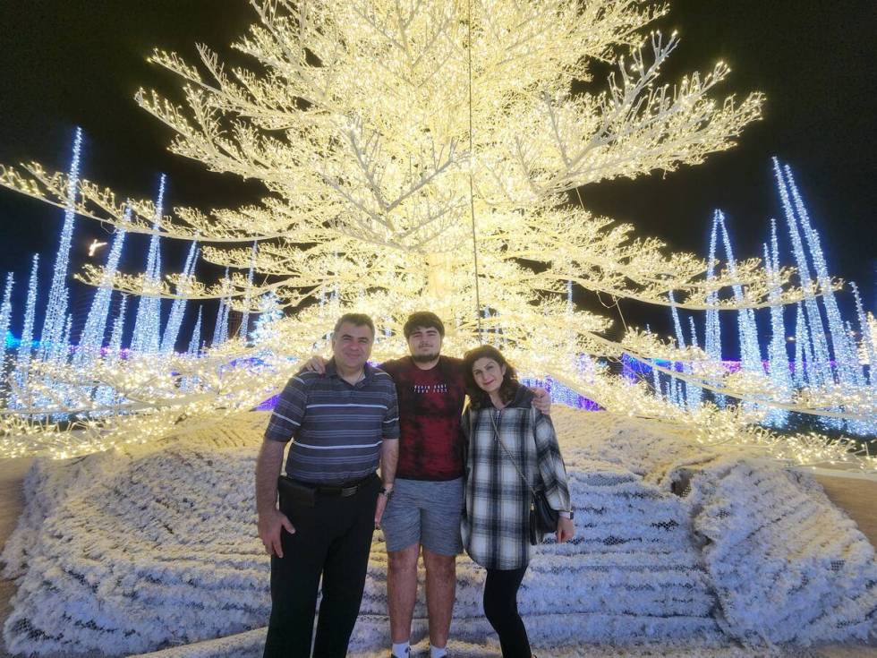 Adonis Banipalsin, center, and his parents, Sarkis Banipalsin, left, and Mari Takiyeh, right, v ...