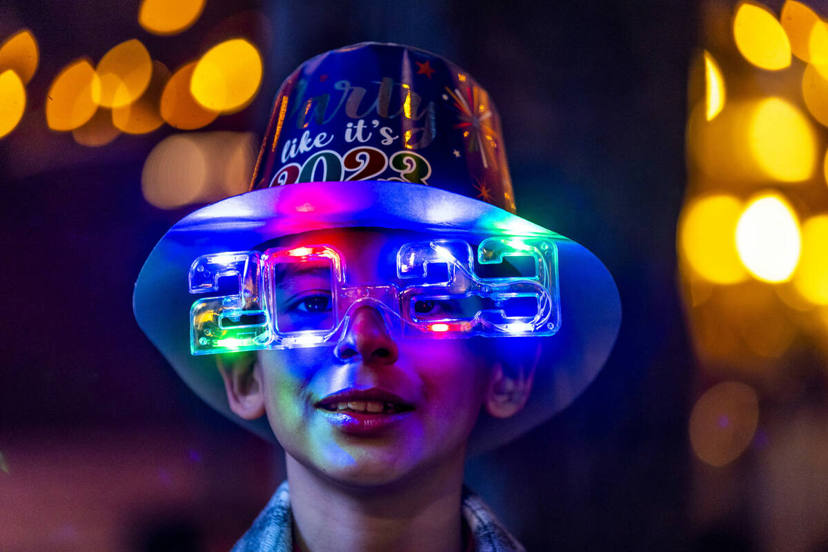Max Agi, 10, is festive with hat and shade while visiting with his family from the Baja, Mexico ...