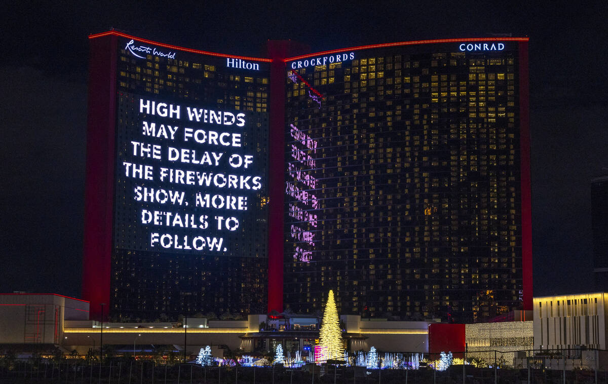 A high winds alert notice on the large video display at Resorts World on New Year’s Eve ...