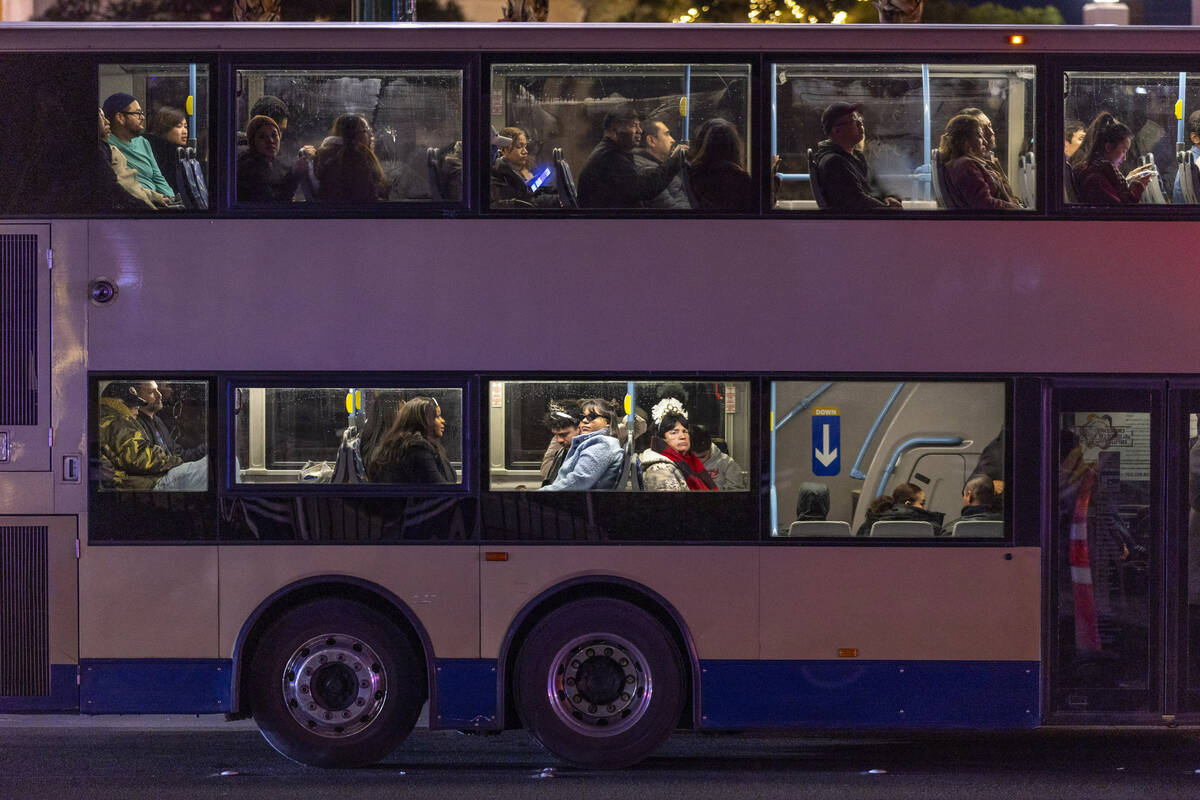 Some RTC riders wear festive hats while commuting on New Year’s Eve along the Strip on S ...