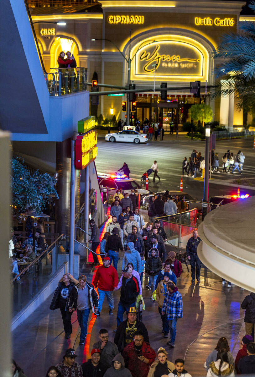 New Year’s Eve revelers make their way along the Strip near Fashion Show Mall on Saturda ...