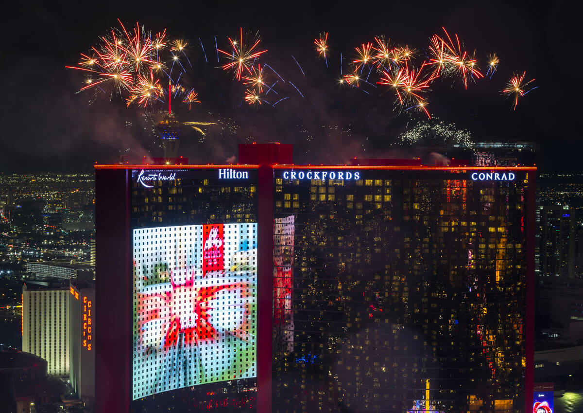 New Year’s Eve fireworks erupt above Resorts World viewed from atop the Trump Tower on S ...