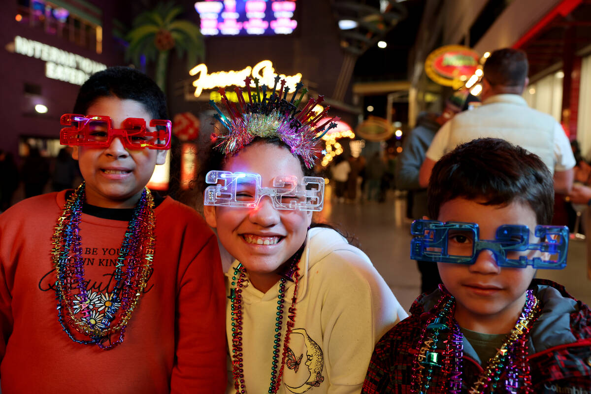 Nathan Zamora, 5, from left, Sophia Mendoza 11, and Nathan Zamora, 5, of Seattle celebrate on N ...
