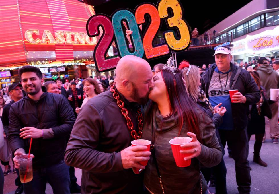 Tim Cocchia kisses his bride, Becky Cocchia, on New Year’s Eve at the Fremont Street Experien ...