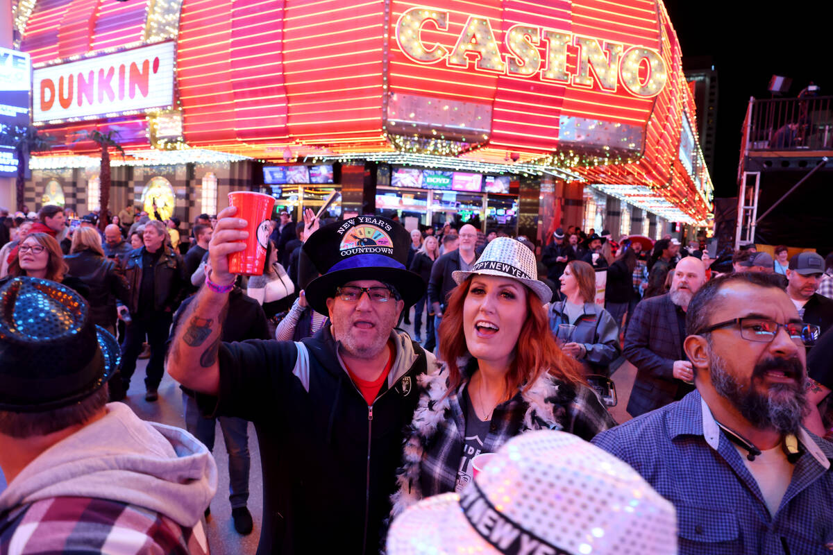 Daniel and Kate Freitas of Fresno, Calif. celebrate on New Year’s Eve at the Fremont Str ...