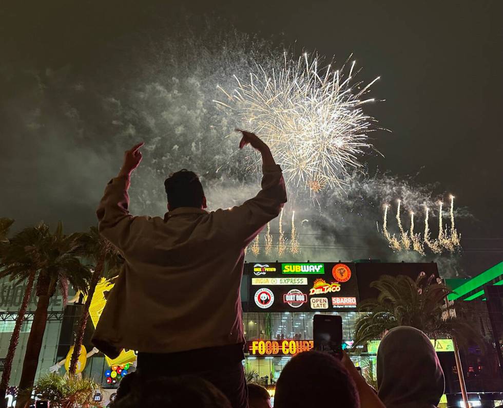 Jonathan cheers the Strip fireworks in front of New York New York on Jan. 1, 2023. (Brett Clark ...