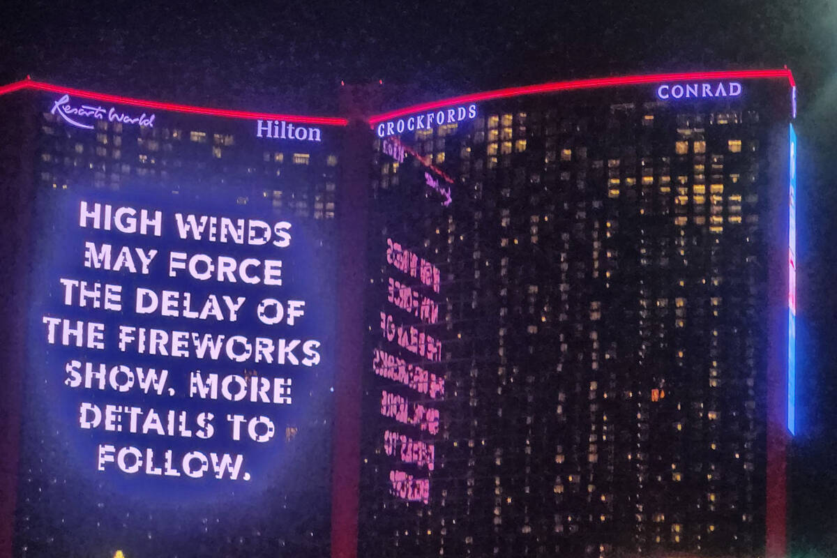 A sign at Resorts World warns that winds could delay the start of fireworks on New Years Eve. ( ...