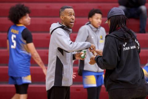 Democracy Prep assistant coach Mark Coleman instructs players before a game against Anchorage C ...
