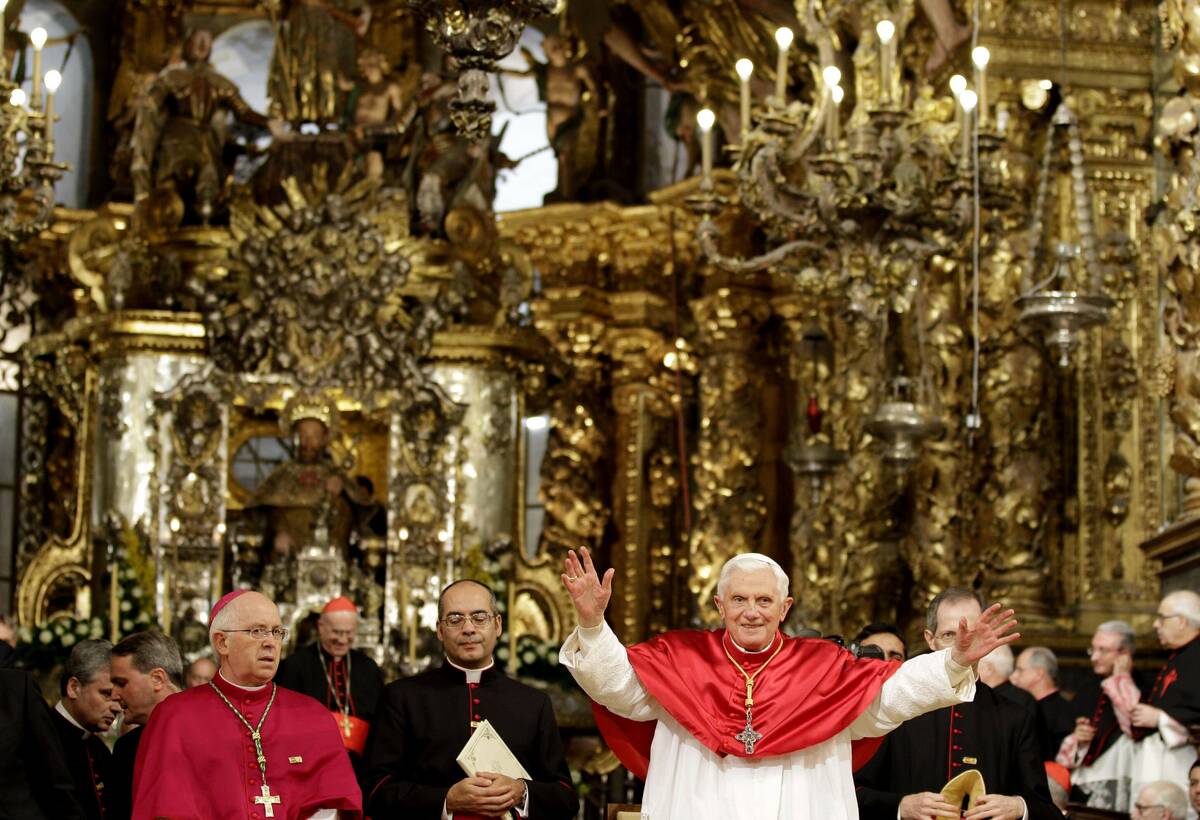 Pope Benedict XVI waves during his visit to the Cathedral of Santiago de Compostela, northern S ...