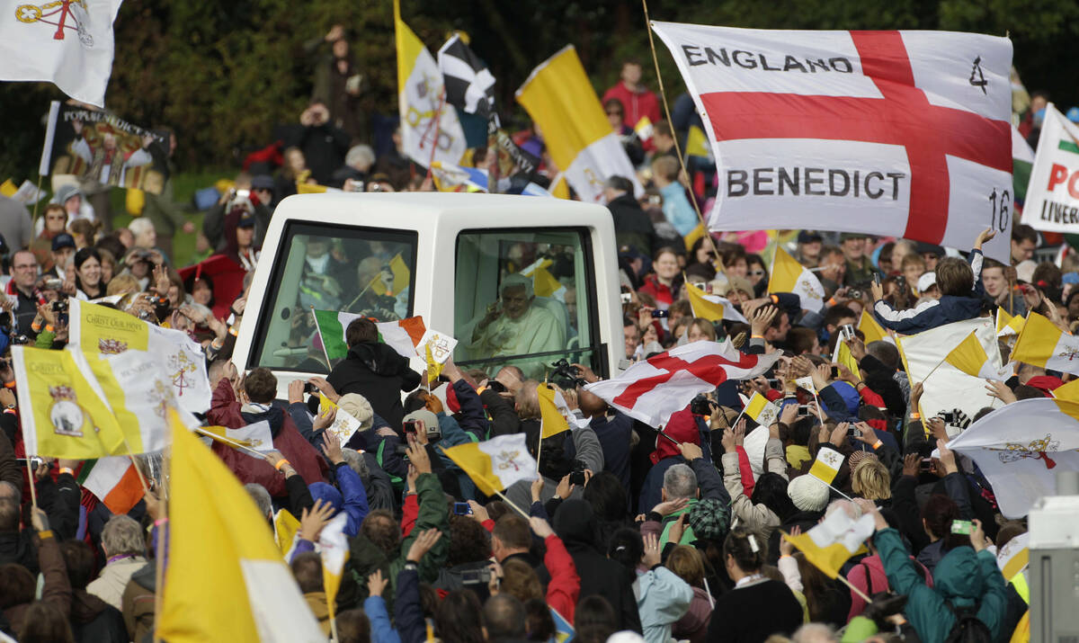 Pope Benedict XVI is cheered by faithful upon his arrival in Cofton park to celebrate a beatifi ...