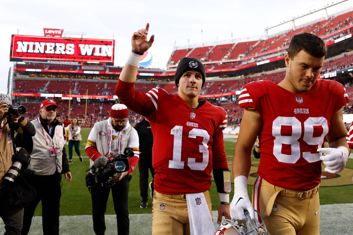 San Francisco 49ers quarterback Brock Purdy (13) gestures as he walks off the field with teamma ...