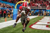 Georgia wide receiver Adonai Mitchell (5) makes a touchdown catch against Ohio State cornerback ...