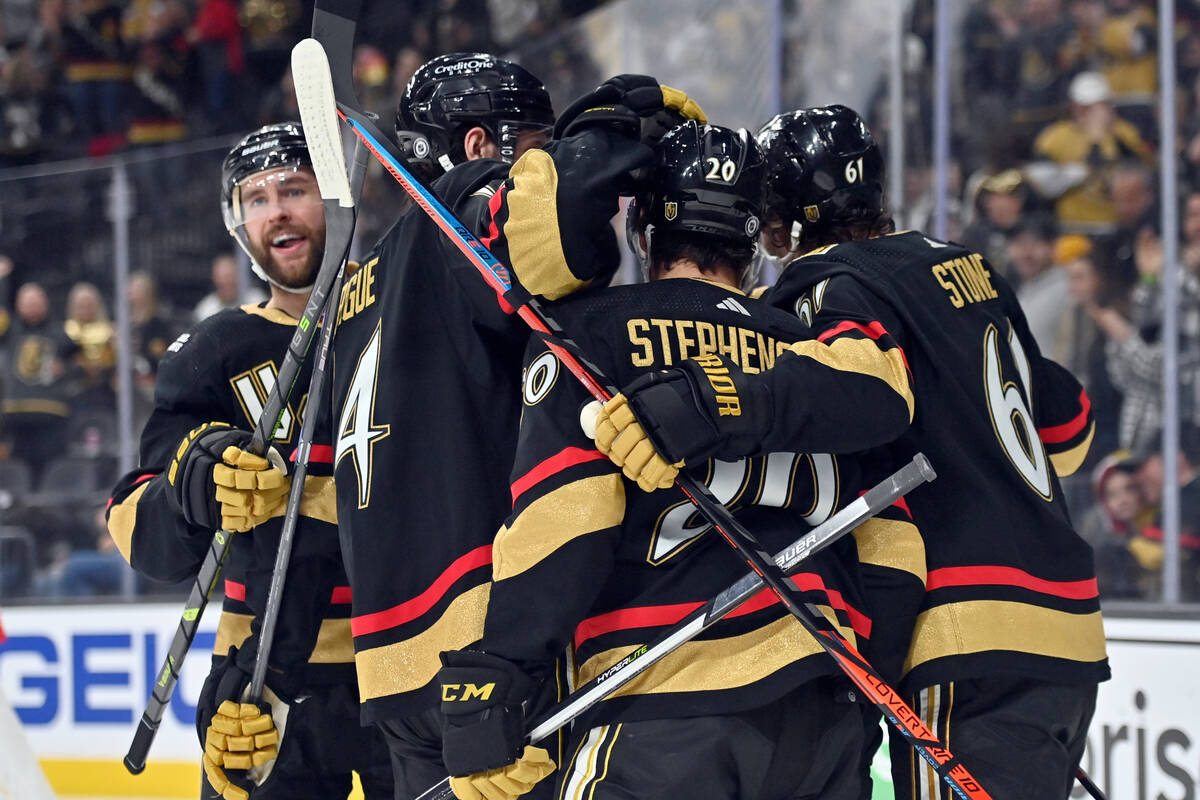 Vegas Golden Knights defenseman Alex Pietrangelo, left, and teammates celebrate after a goal ag ...
