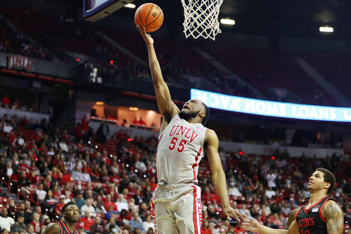 UNLV Rebels guard EJ Harkless (55) goes up for a shot as San Diego State Aztecs guard Matt Brad ...
