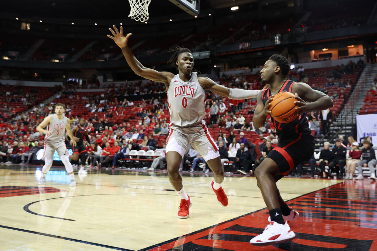 UNLV Rebels forward Victor Iwuakor (0) defends an inbound pass from San Diego State Aztecs guar ...