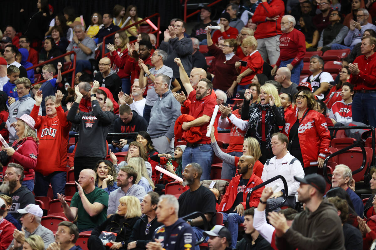 Fans cheer during the second half of an NCAA college basketball game between the UNLV Rebels an ...