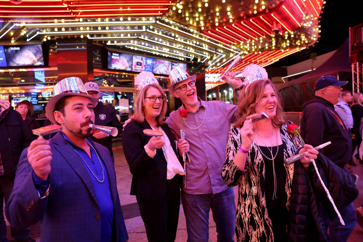 Revelers, from left, Rez Zia, Eric Bialo, Deb Bialo and Rachelle Zia, celebrate on New Year&#x2 ...