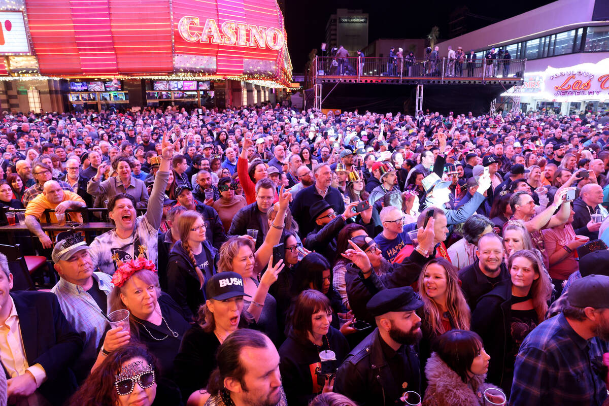 New Year’s Eve revelers rock out to Bush performing on the 3rd Street State at the Fremo ...
