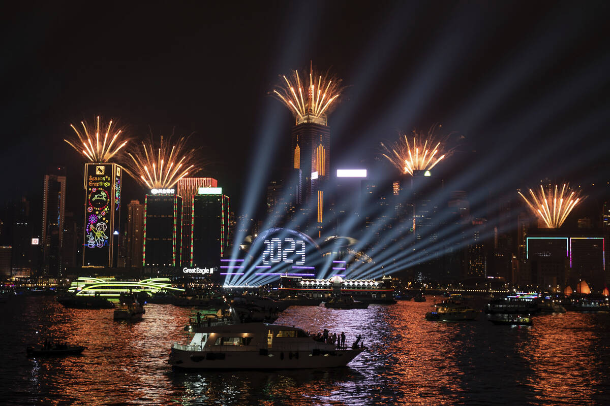Fireworks are seen over Victoria Harbour at midnight on New Years Sunday Jan. 1, 2023 in Hong K ...