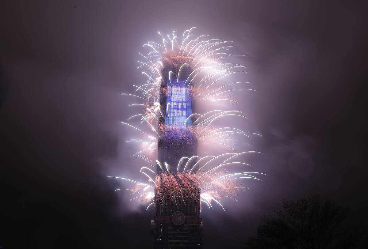 A firework display explodes off Taiwan's tallest skyscraper Taipei101 to usher in the New Year ...