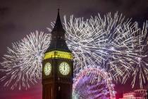 Fireworks light up the sky over the London Eye and the Elizabeth Tower, also known as "Big ...