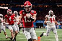 Georgia quarterback Stetson Bennett (13) runs toward the end zone for a touchdown against Ohio ...