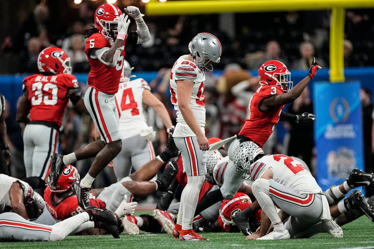 Ohio State place kicker Noah Ruggles (95) reacts to his missed field goal against Georgia durin ...