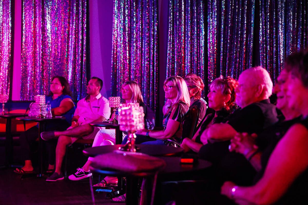 Guests watch the “Spirit of the King,” an Elvis Presley tribute show, at LaMarre ...