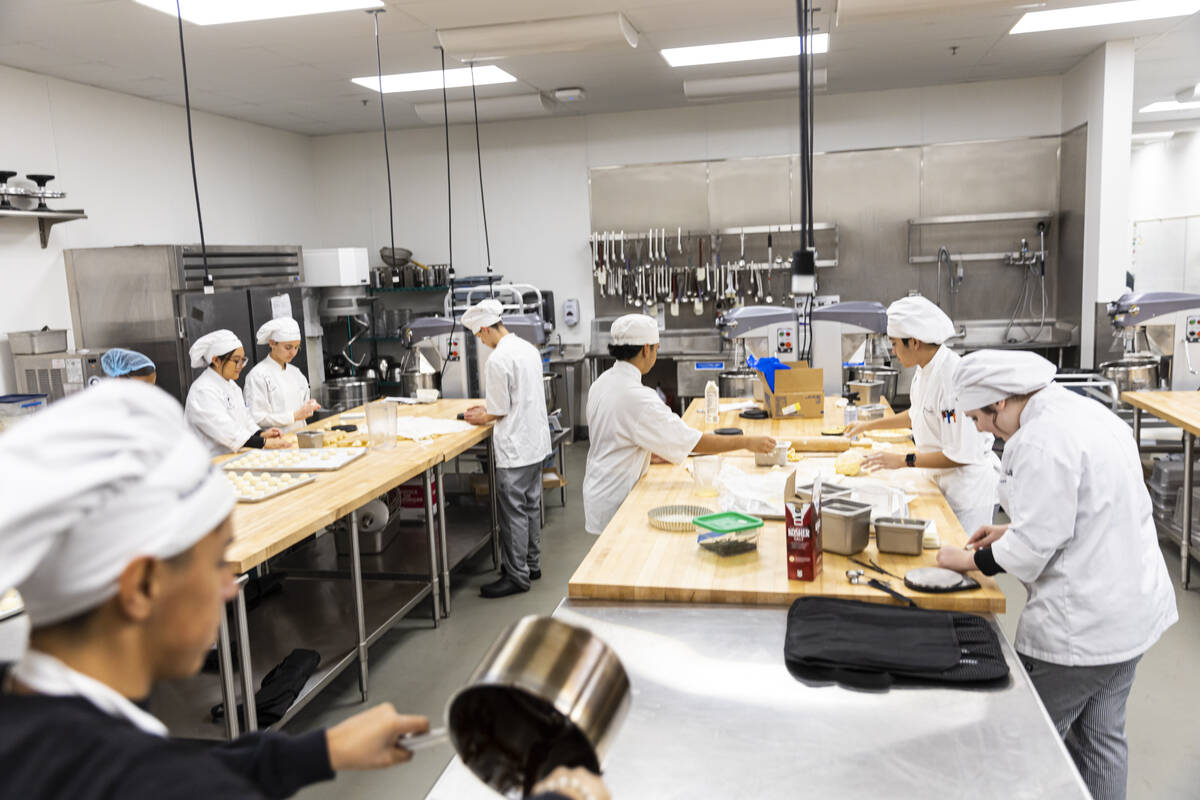 Southeast Career Technical Academy culinary students prepare bread rolls in the kitchen on Tues ...
