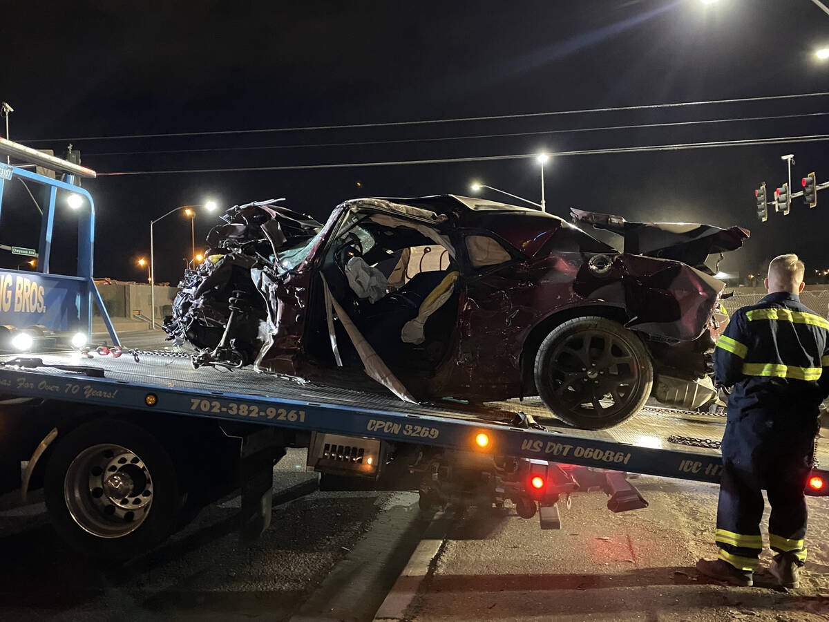 What's left of Gary Dean Robinson's Dodge Challenger is loaded on a truck bed after the crash a ...