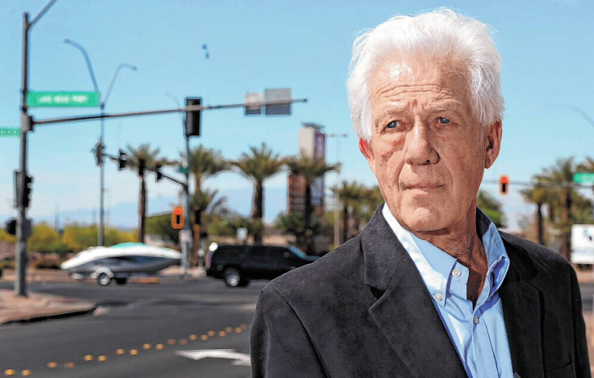 Former Las Vegas Review-Journal reporter Keith Rogers poses for a portrait at the intersection ...