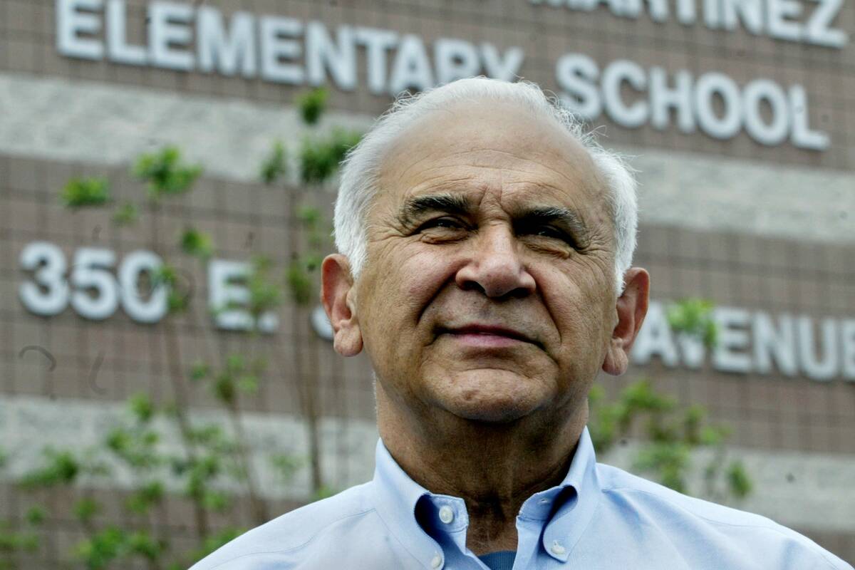 Rey Martinez stands in front of the Reynaldo L. Martinez Elementary School in 2006, a North Las ...