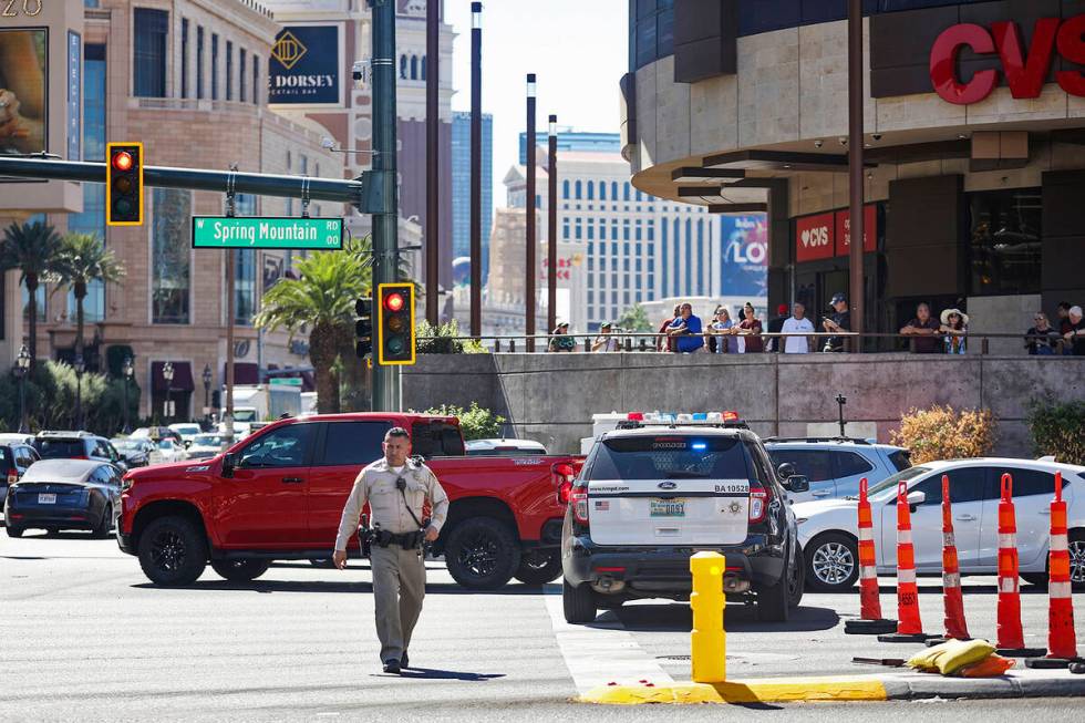 Police work at the scene where multiple people were stabbed in front of a Strip casino in Las V ...