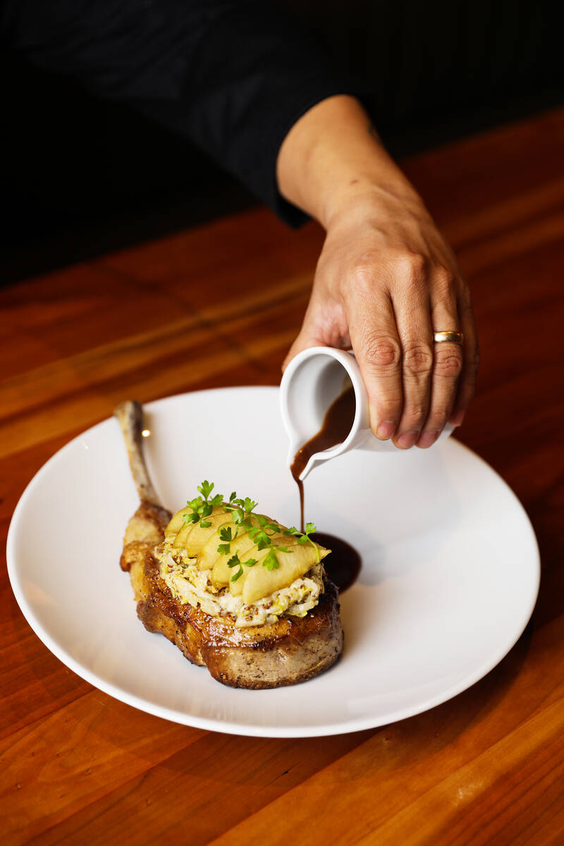 Kurobuta pork tomahawk at Michael Mina’s StripSteak at Mandalay Bay in Las Vegas, Wednes ...