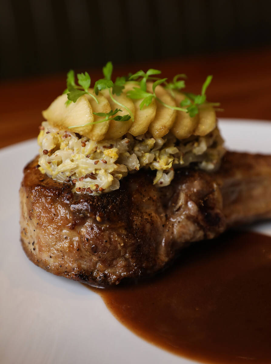 Kurobuta pork tomahawk at Michael Mina’s StripSteak at Mandalay Bay in Las Vegas, Wednes ...