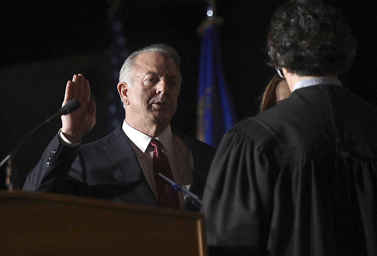 Gov. Joe Lombardo takes his oath of office during his inauguration ceremony in the Carson City ...