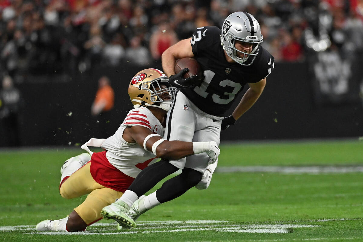 Las Vegas Raiders wide receiver Hunter Renfrow (13) is tackled by San Francisco 49ers cornerbac ...