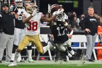 Las Vegas Raiders wide receiver Davante Adams (17) catches a pass while being defended by San F ...