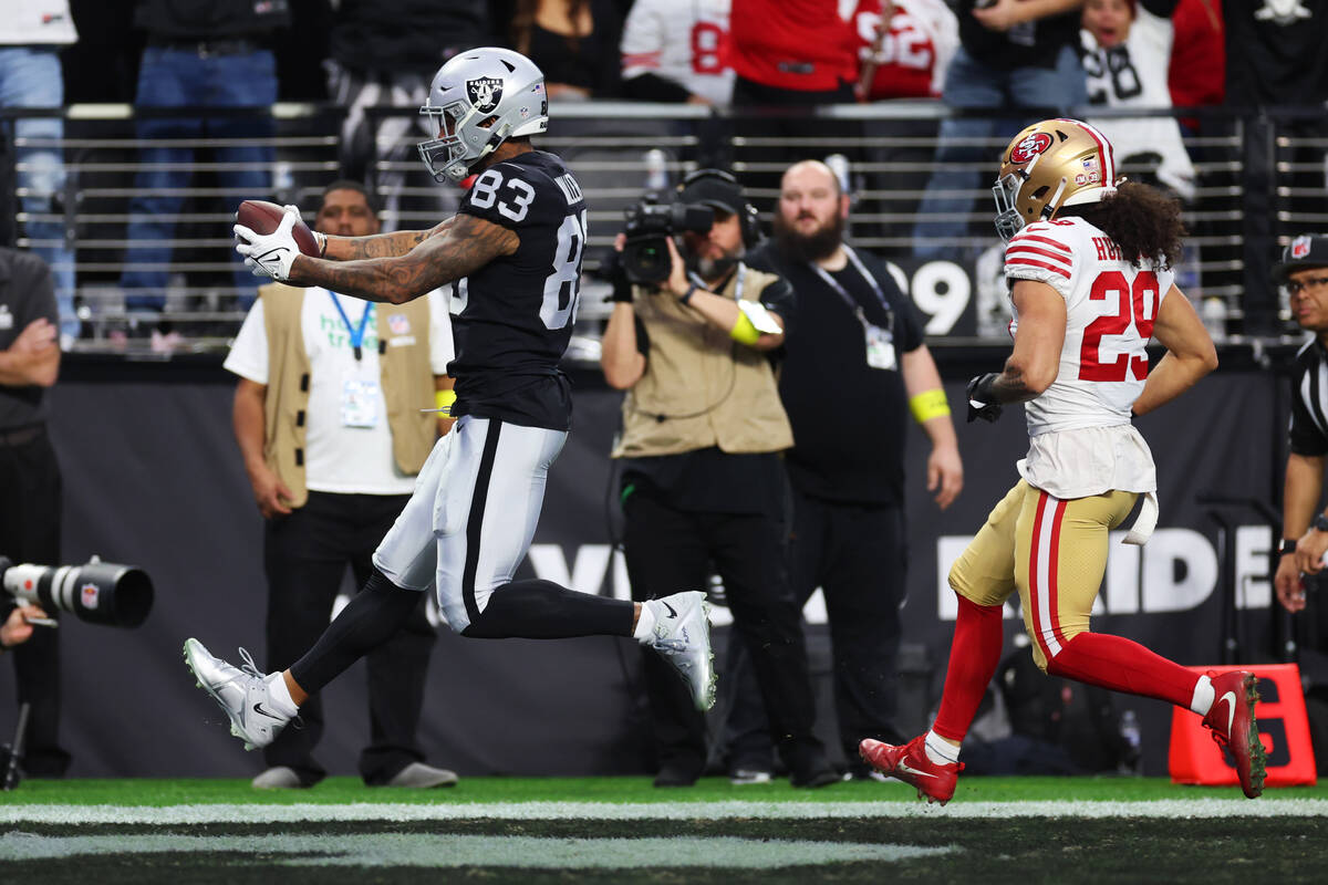Raiders tight end Darren Waller (83) makes a touchdown catch as San Francisco 49ers safety Tala ...