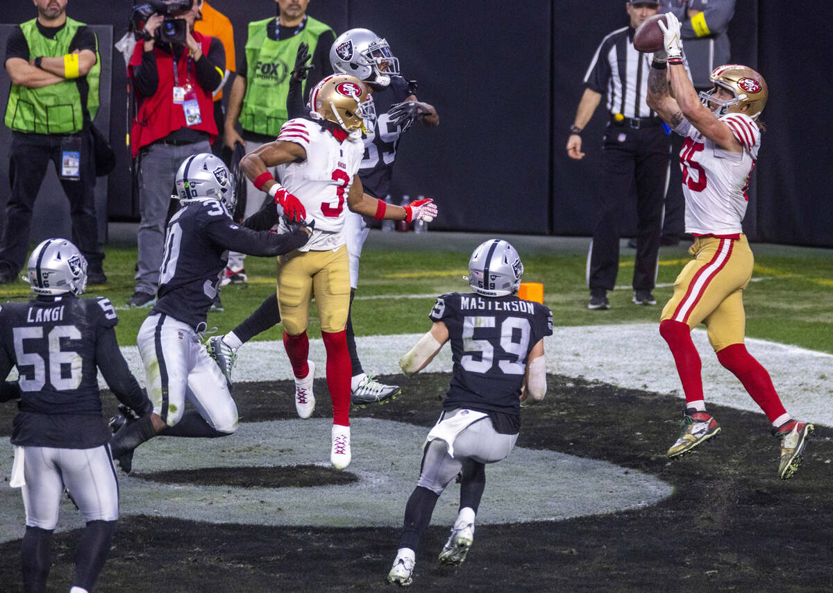 San Francisco 49ers tight end George Kittle (85) leaps to secure a touchdown pass as Raiders li ...