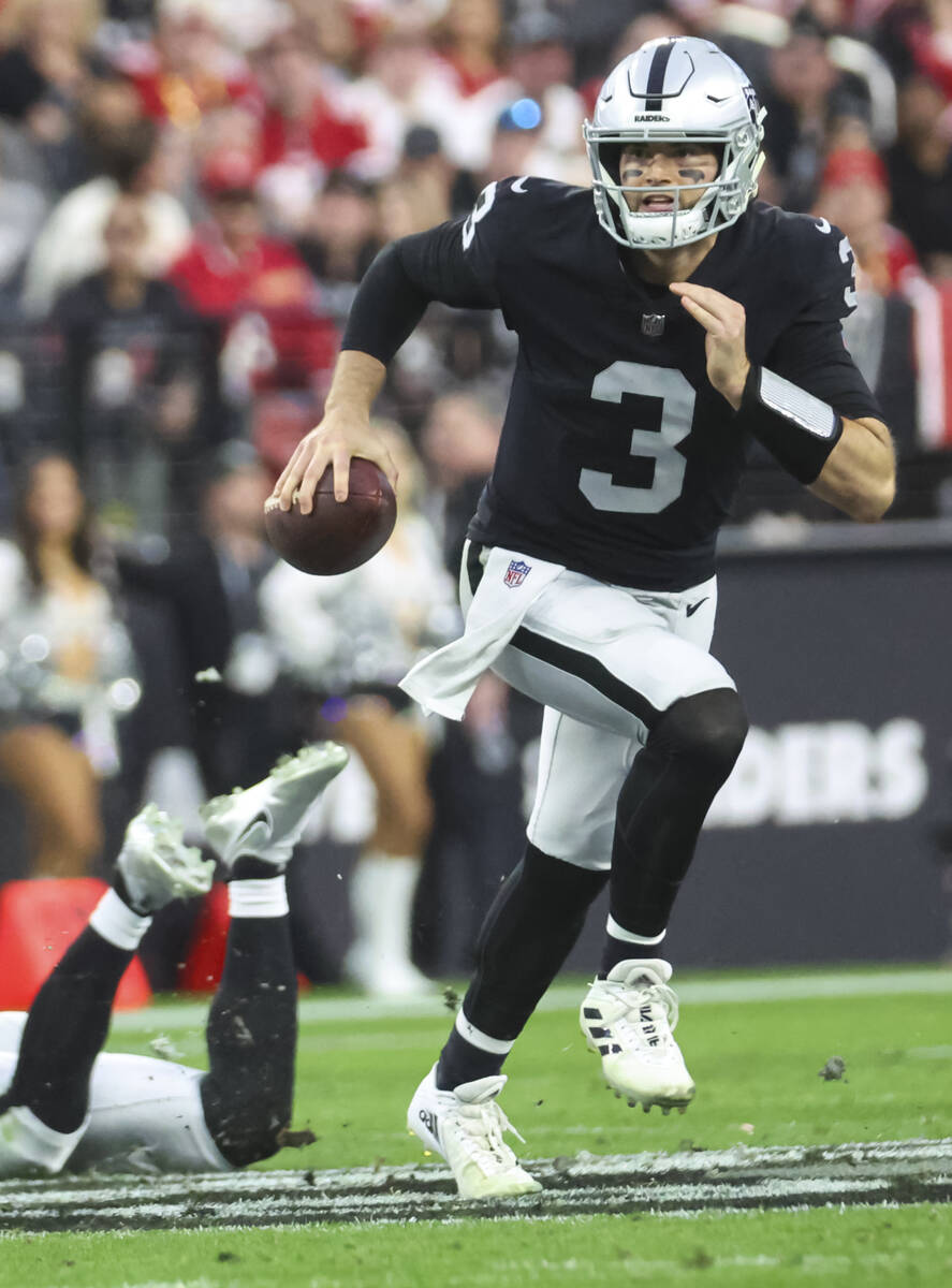 Raiders quarterback Jarrett Stidham (3) runs the ball during the first half of an NFL game agai ...