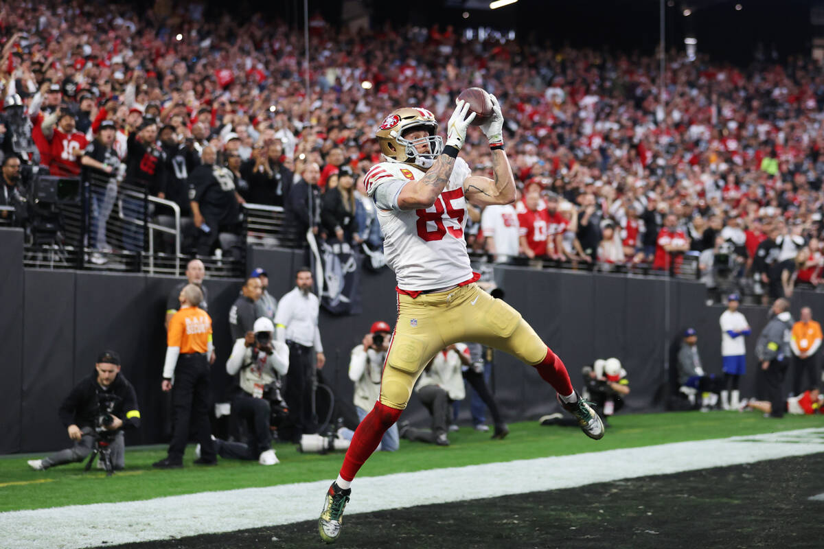 San Francisco 49ers tight end George Kittle (85) makes a touchdown catch against the Raiders du ...