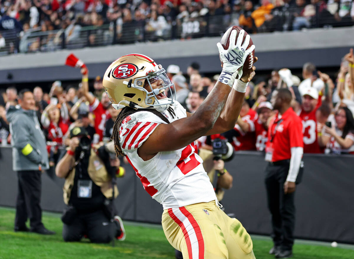 San Francisco 49ers running back Jordan Mason (24) celebrates a touchdown catch during the seco ...