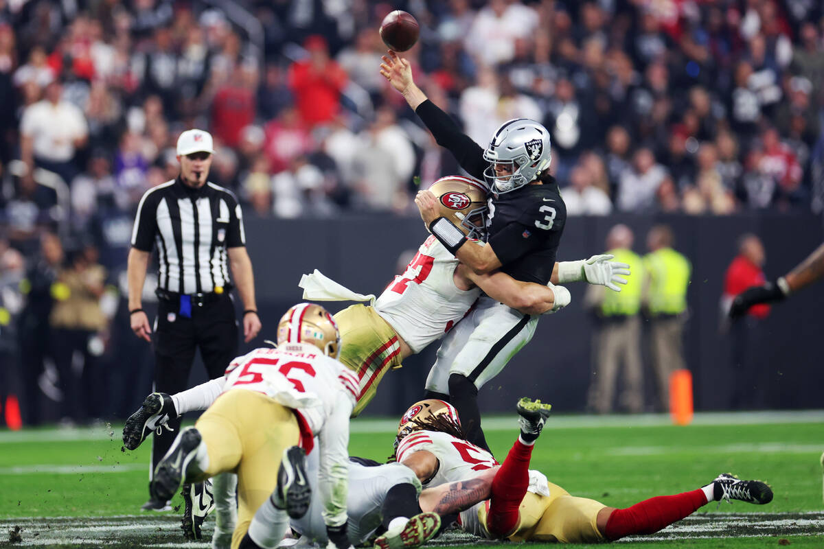 San Francisco 49ers defensive end Nick Bosa (97) tackles Raiders quarterback Jarrett Stidham (3 ...