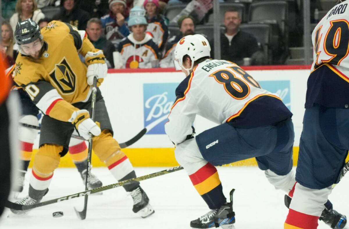 Vegas Golden Knights center Nicolas Roy, left, shoots the puck for a goal past Colorado Avalanc ...