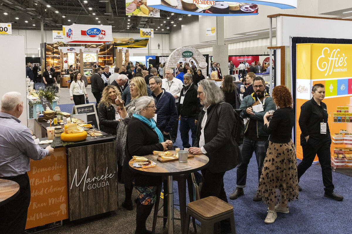 Showgoers check out food products during Fancy Food Show at the Las Vegas convention Center on ...