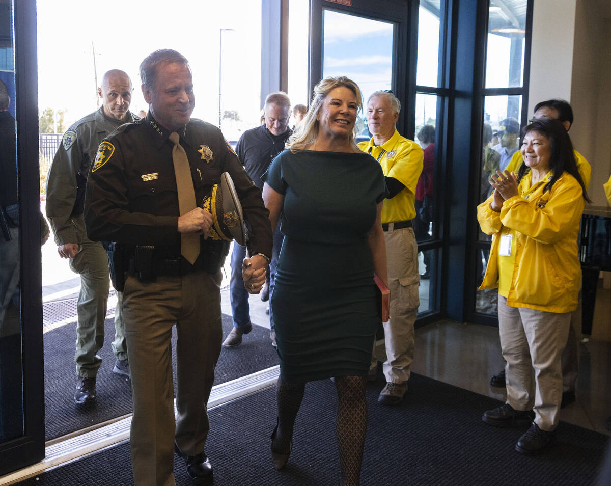 Sheriff-elect Kevin McMahill, left, greeted by Las Vegas police volunteers as he arrives at Bli ...