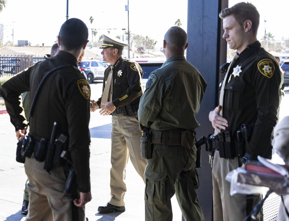 Sheriff-elect Kevin McMahill, center, greeted by Las Vegas police officers as he arrives at Bli ...